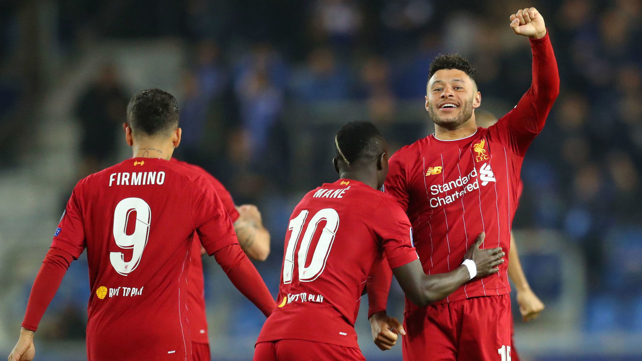 GENK, BELGIUM - OCTOBER 23: Alex Oxlade-Chamberlain of Liverpool celebrates with teammate Sadio Mane after scoring his team's first goal during the UEFA Champions League group E match between KRC Genk and Liverpool FC at Luminus Arena on October 23, 2019 in Genk, Belgium.
