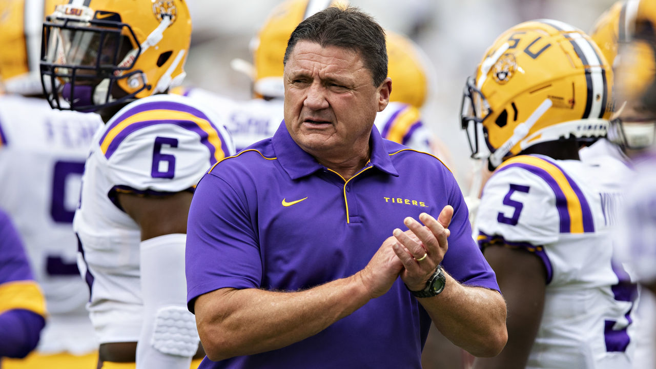 STARKVILLE, MS - OCTOBER 19: Head Coach Ed Orgeron of the LSU Tigers watches his team warm up before a game against the Mississippi State Bulldogs at Davis Wade Stadium on October 19, 2019 in Starkville, Mississippi. The Tigers defeated the Bulldogs 36-13.