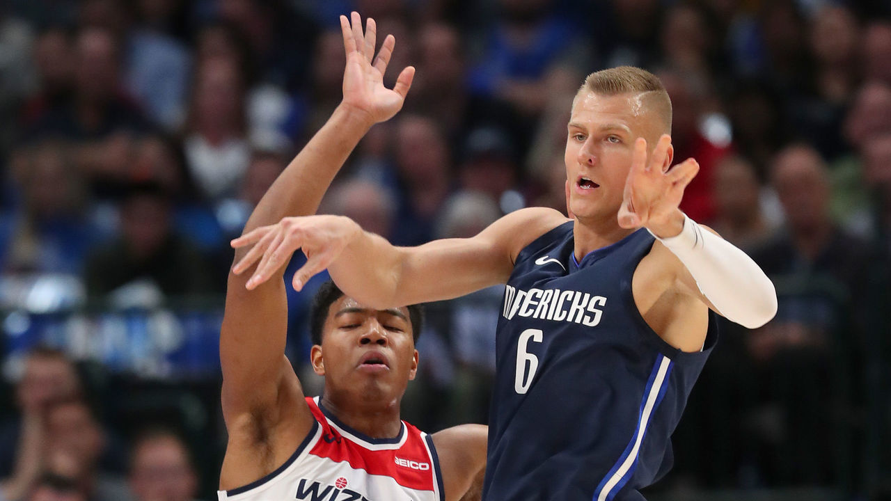 DALLAS, TEXAS - OCTOBER 23: Kristaps Porzingis #6 of the Dallas Mavericks passes the ball against Rui Hachimura #8 of the Washington Wizards in the first half at American Airlines Center on October 23, 2019 in Dallas, Texas.