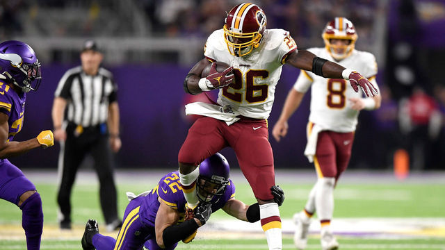 MINNEAPOLIS, MINNESOTA - OCTOBER 24: Running back Adrian Peterson #26 of the Washington Redskins is tackled by Harrison Smith #22 of the Minnesota Vikings during the game at U.S. Bank Stadium on October 24, 2019 in Minneapolis, Minnesota.