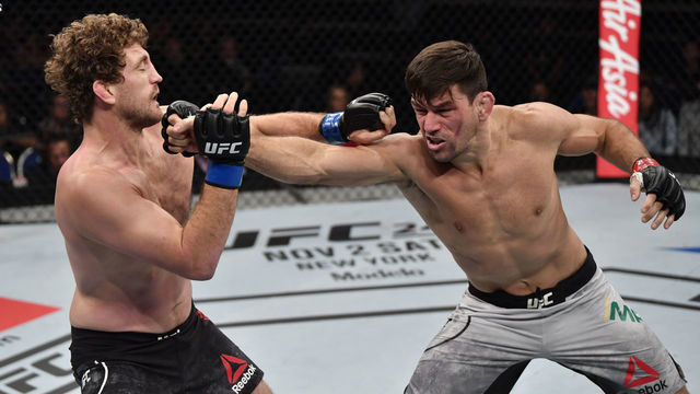 SINGAPORE, SINGAPORE - OCTOBER 26: (R-L) Demian Maia of Brazil punches Ben Askren in their welterweight bout during the UFC Fight Night event at Singapore Indoor Stadium on October 26, 2019 in Singapore.