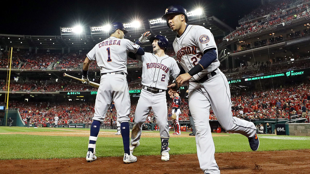 WASHINGTON, DC - OCTOBER 26: Alex Bregman #2 of the Houston Astros is congratulated by his teammate Carlos Correa #1 after hitting a grand slam home run against the Washington Nationals during the seventh inning in Game Four of the 2019 World Series at Nationals Park on October 26, 2019 in Washington, DC.