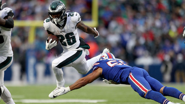 ORCHARD PARK, NEW YORK - OCTOBER 27: Miles Sanders #26 of the Philadelphia Eagles runs the ball as Matt Milano #58 of the Buffalo Bills attempts to tackle him during the third quarter of an NFL game at New Era Field on October 27, 2019 in Orchard Park, New York.