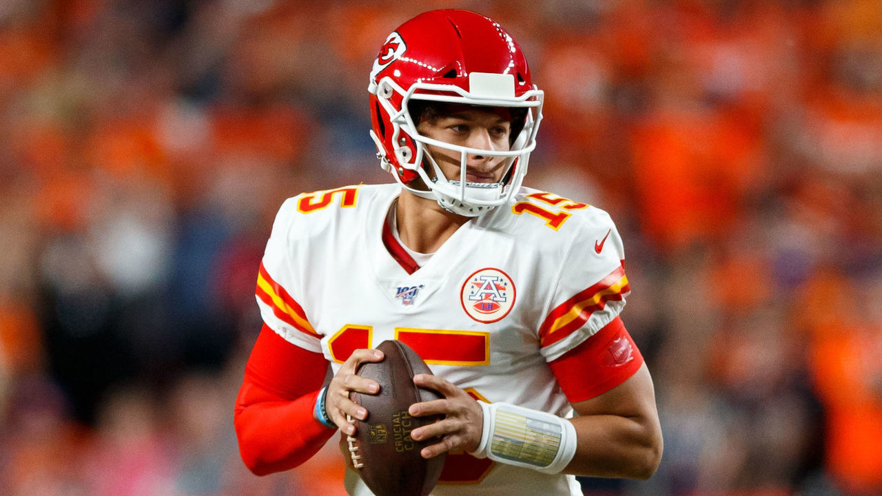 DENVER, CO - OCTOBER 17: Quarterback Patrick Mahomes #15 of the Kansas City Chiefs looks to pass against the Denver Broncos during the first quarter at Empower Field at Mile High on October 17, 2019 in Denver, Colorado.