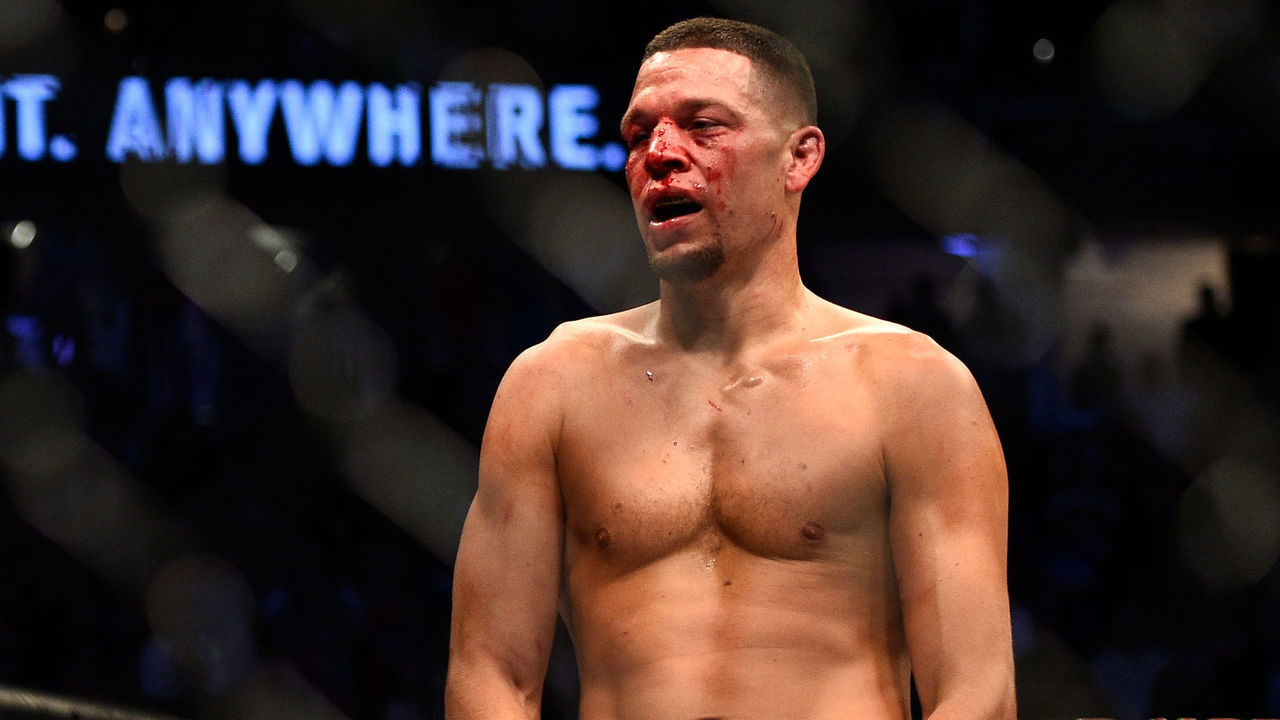LAS VEGAS, NV - AUGUST 20: (R-L) Nate Diaz gestures towards Conor McGregor of Ireland in their welterweight bout during the UFC 202 event at T-Mobile Arena on August 20, 2016 in Las Vegas, Nevada.