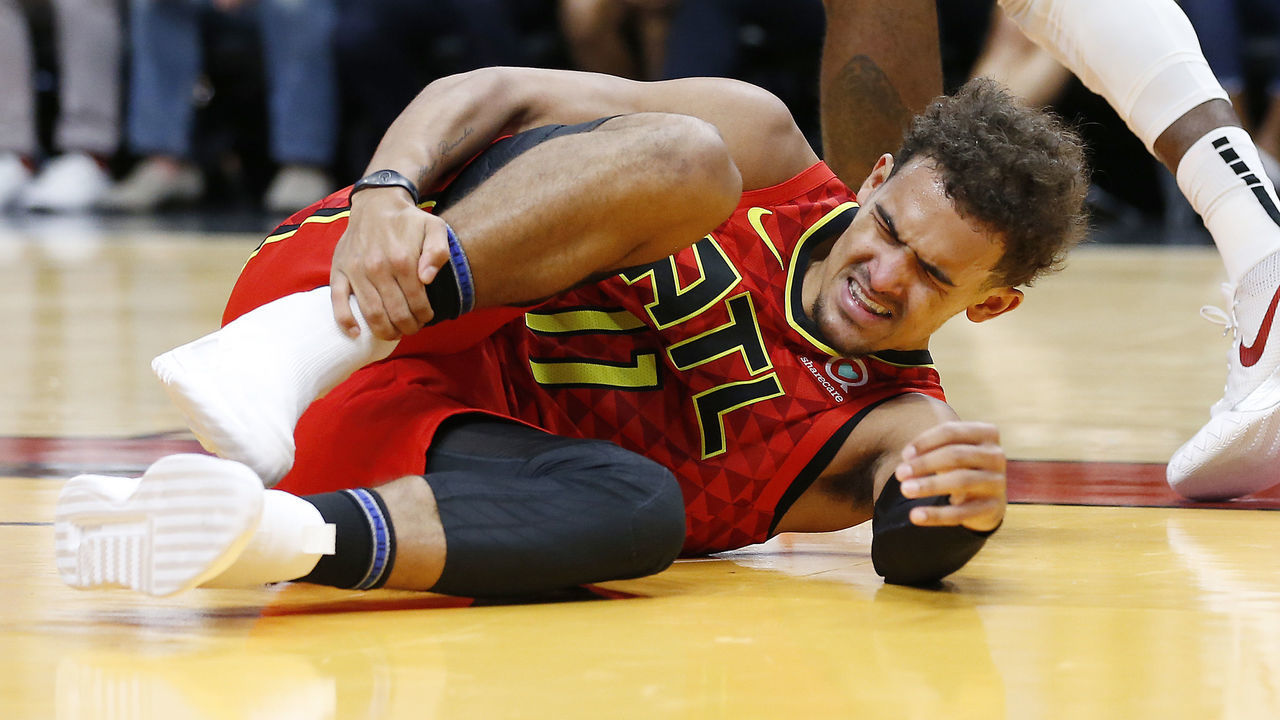 MIAMI, FLORIDA - OCTOBER 29: Trae Young #11 of the Atlanta Hawks is reacts after being injured against the Miami Heat during the first half at American Airlines Arena on October 29, 2019 in Miami, Florida. NOTE TO USER: User expressly acknowledges and agrees that, by downloading and/or using this photograph, user is consenting to the terms and conditions of the Getty Images License Agreement.