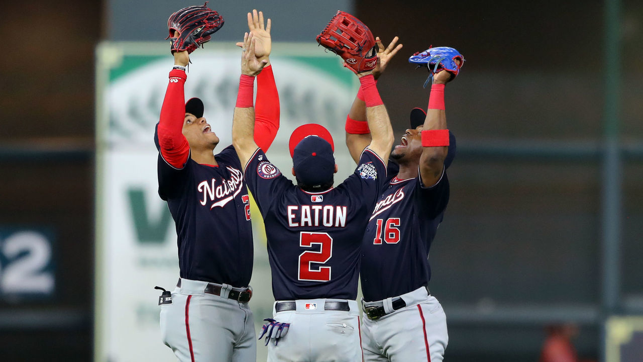 HOUSTON, TX - OCTOBER 29: Juan Soto #22, Adam Eaton #2, and Victor Robles #16 of the Washington Nationals celebrate after the Nationals defeat the Houston Astros in Game 6 of the 2019 World Series at Minute Maid Park on Tuesday, October 29, 2019 in Houston, Texas.