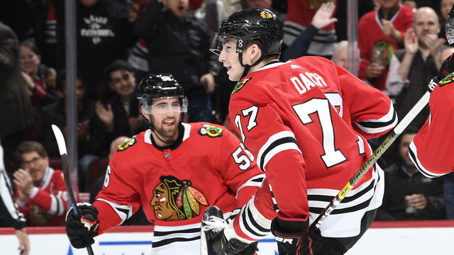 CHICAGO, IL - OCTOBER 22: Erik Gustafsson #56 and Kirby Dach #77 of the Chicago Blackhawks celebrate after Dach scored against the Vegas Golden Knights in the first period at the United Center on October 22, 2019 in Chicago, Illinois.