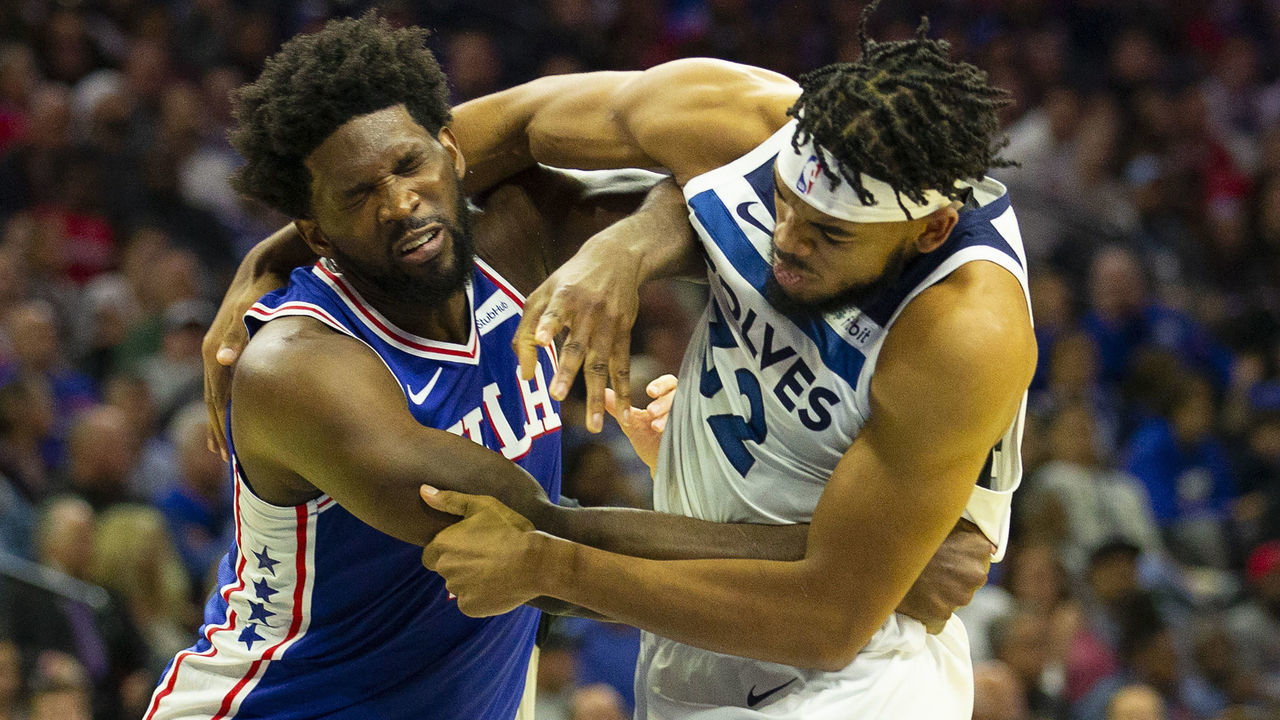 PHILADELPHIA, PA - OCTOBER 30: Joel Embiid #21 of the Philadelphia 76ers gets in a fight with Karl-Anthony Towns #32 of the Minnesota Timberwolves in the third quarter at the Wells Fargo Center on October 30, 2019 in Philadelphia, Pennsylvania.