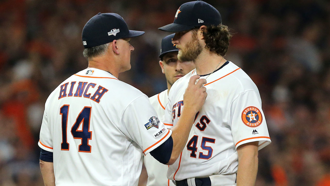 HOUSTON, TEXAS - OCTOBER 05: Manager A. J. Hinch of the Houston Astros takes out starting pitcher Gerrit Cole #45 during the eighth inning of Game 2 of the ALDS against the Tampa Bay Rays at Minute Maid Park on October 05, 2019 in Houston, Texas.