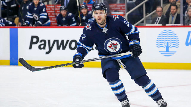 WINNIPEG, MB - OCTOBER 10: Mark Letestu #22 of the Winnipeg Jets keeps an eye on the play during first period action against the Minnesota Wild at the Bell MTS Place on October 10, 2019 in Winnipeg, Manitoba, Canada. The Jets defeated the Wild 5-2.