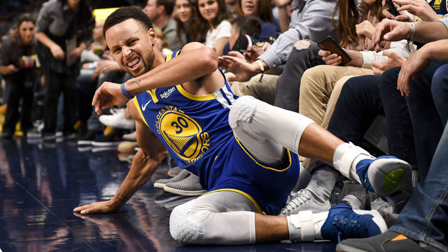DENVER, CO - OCTOBER 21: Stephen Curry (30) of the Golden State Warriors winces after falling to the ground upon absorbing contact against the Denver Nuggets during the second half of the Nuggets' 100-98 win on Sunday, October 21, 2018. The Denver Nuggets hosted the Golden State Warriors at the Pepsi Center in Denver.