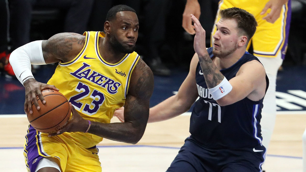 DALLAS, TEXAS - NOVEMBER 01: LeBron James #23 of the Los Angeles Lakers dribbles the ball against Luka Doncic #77 of the Dallas Mavericks in the first quarter at American Airlines Center on November 01, 2019 in Dallas, Texas.