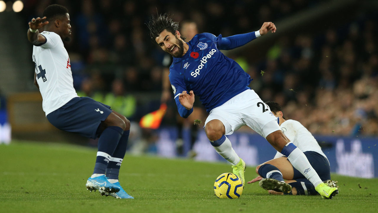 LIVERPOOL, ENGLAND - NOVEMBER 03: Andre Gomes of Everton is tackled by Son Heung-Min of Tottenham Hotspur during the Premier League match between Everton FC and Tottenham Hotspur at Goodison Park on November 03, 2019 in Liverpool, United Kingdom.