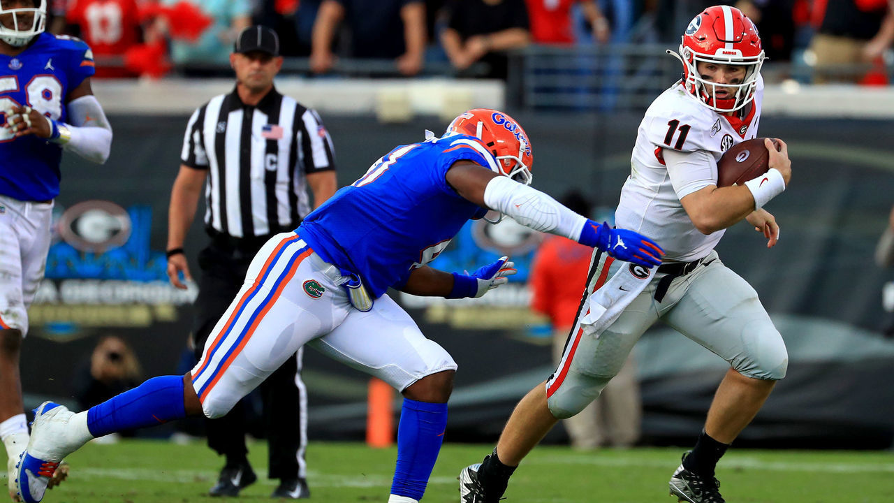 JACKSONVILLE, FLORIDA - NOVEMBER 02: Jake Fromm #11 of the Georgia Bulldogs rushes during a game against the Georgia Bulldogs on November 02, 2019 in Jacksonville, Florida.