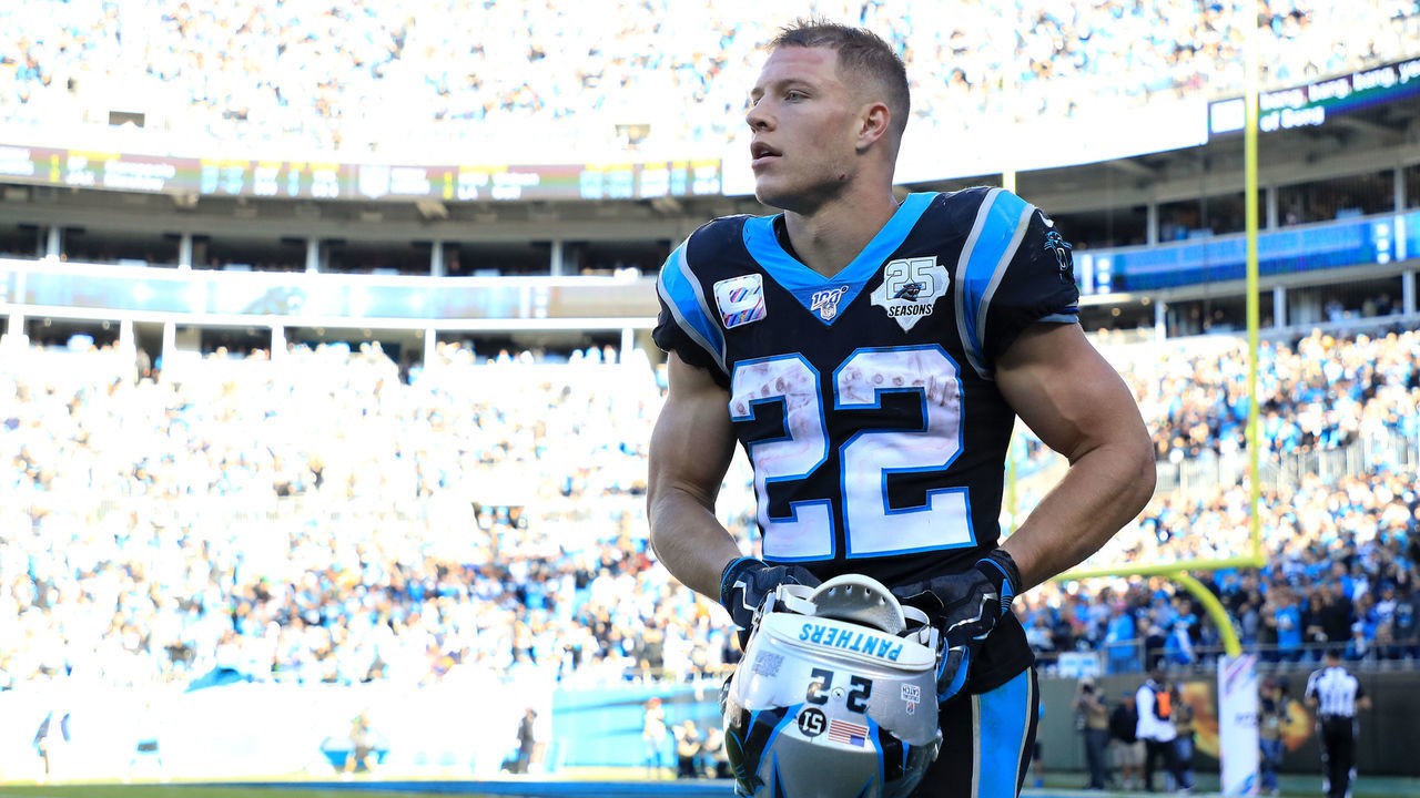 CHARLOTTE, NORTH CAROLINA - NOVEMBER 03: Christian McCaffrey #22 of the Carolina Panthers walks off the field after running for a touchdown against the Tennessee Titans during their game at Bank of America Stadium on November 03, 2019 in Charlotte, North Carolina.