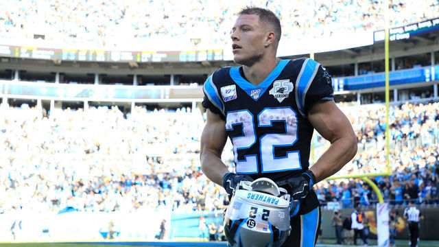 CHARLOTTE, NORTH CAROLINA - NOVEMBER 03: Christian McCaffrey #22 of the Carolina Panthers walks off the field after running for a touchdown against the Tennessee Titans during their game at Bank of America Stadium on November 03, 2019 in Charlotte, North Carolina.