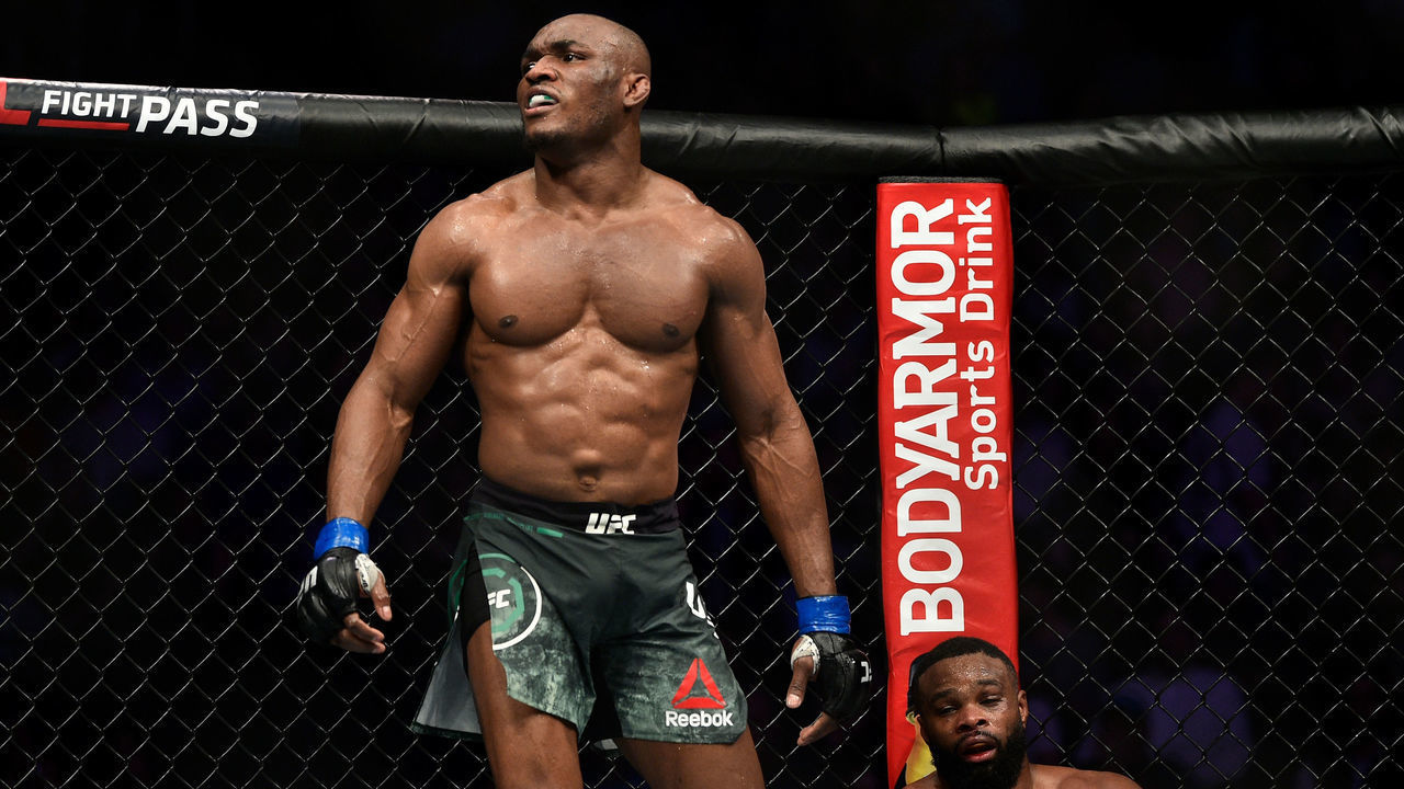 LAS VEGAS, NEVADA - MARCH 02: (L-R) Kamaru Usman of Nigeria reacts after the conclusion of his welterweight championship bout against Tyron Woodley during the UFC 235 event at T-Mobile Arena on March 2, 2019 in Las Vegas, Nevada.