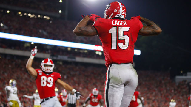 ATHENS, GA - SEPTEMBER 21: Georgia Bulldogs wide receiver Lawrence Cager (15) reacts after scoring a touchdown with tight end Charlie Woerner (89) during the second half of the Notre Dame Fighting Irish v Georgia Bulldogs game on September 21, 2019 at Sanford Stadium in Athens, GA.