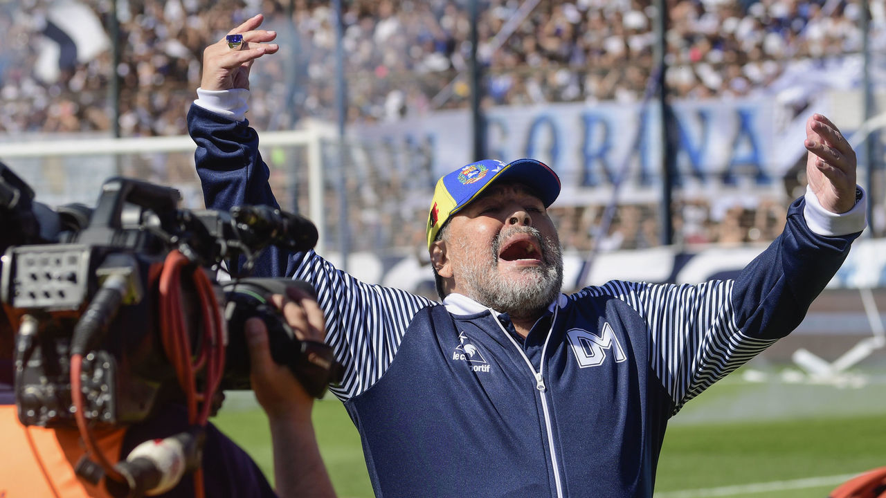 LA PLATA, ARGENTINA - NOVEMBER 02: Diego Armando Maradona coach of Gimnasia y Esgrima greets the fans prior a match between Gimnasia y Esgrima La Plata and Estudiantes as part of Superliga Argentina 2019/20 at Juan Carmelo Zerillo on November 2, 2019 in La Plata, Argentina.