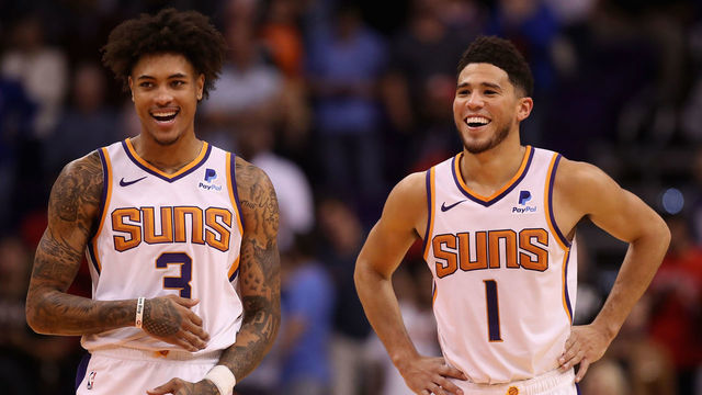 PHOENIX, ARIZONA - NOVEMBER 04: Kelly Oubre Jr. #3 and Devin Booker #1 of the Phoenix Suns react during the final moments of the second half of the NBA game against the Phoenix Suns at Talking Stick Resort Arena on November 04, 2019 in Phoenix, Arizona. The Suns defeated the 76ers 114-109. NOTE TO USER: User expressly acknowledges and agrees that, by downloading and/or using this photograph, user is consenting to the terms and conditions of the Getty Images License Agreement