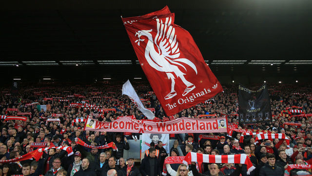 LIVERPOOL, ENGLAND - OCTOBER 27: Liverpool fans wave their flags and banners in The Kop before the Premier League match between Liverpool FC and Tottenham Hotspur at Anfield on October 27, 2019 in Liverpool, United Kingdom.