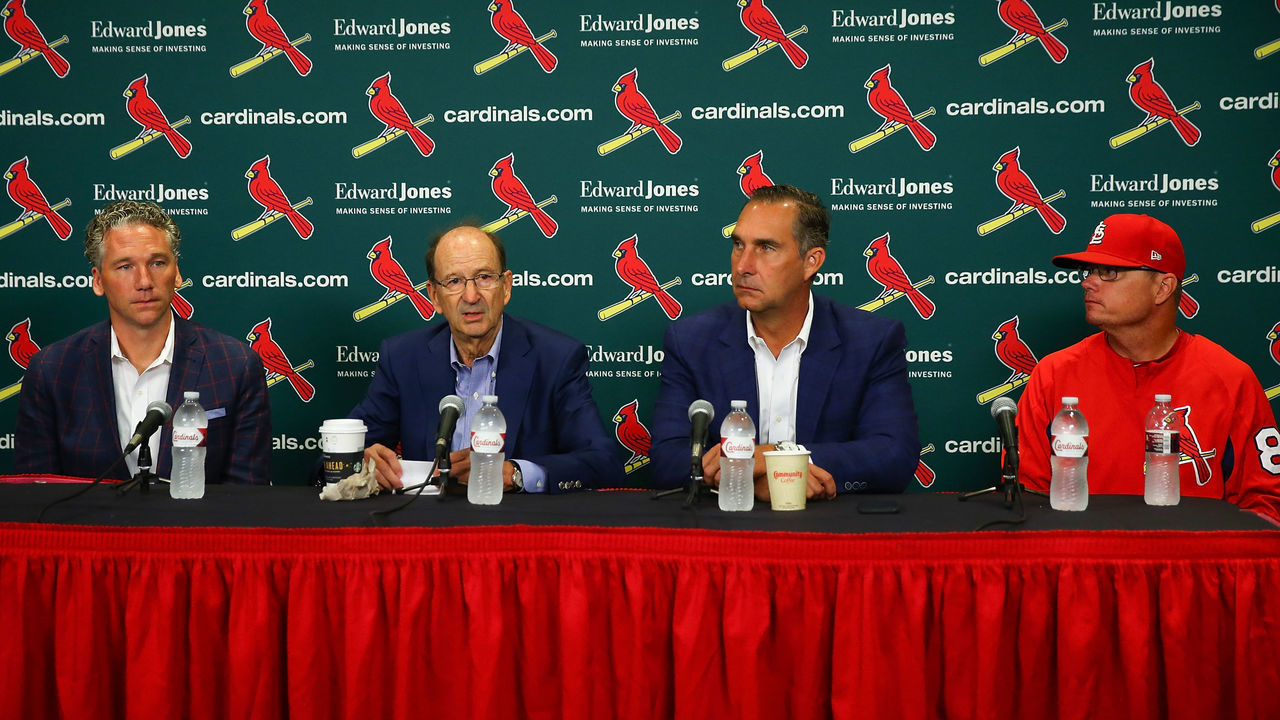 ST. LOUIS, MO - JULY 15: (L to R) Mike Girsch, general manager of the St. Louis Cardinals; Bill DeWitt Jr., managing partner and chairman of the St. Louis Cardinals; John Mozeliak, President of Baseball Operations of the St. Louis Cardinals and Mike Schildt, interim manager of the St. Louis Cardinals addressing a change in the manager during a press conference prior to a game between the St. Louis Cardinals and the Cincinnati Reds at Busch Stadium on July 15, 2018 in St. Louis, Missouri.