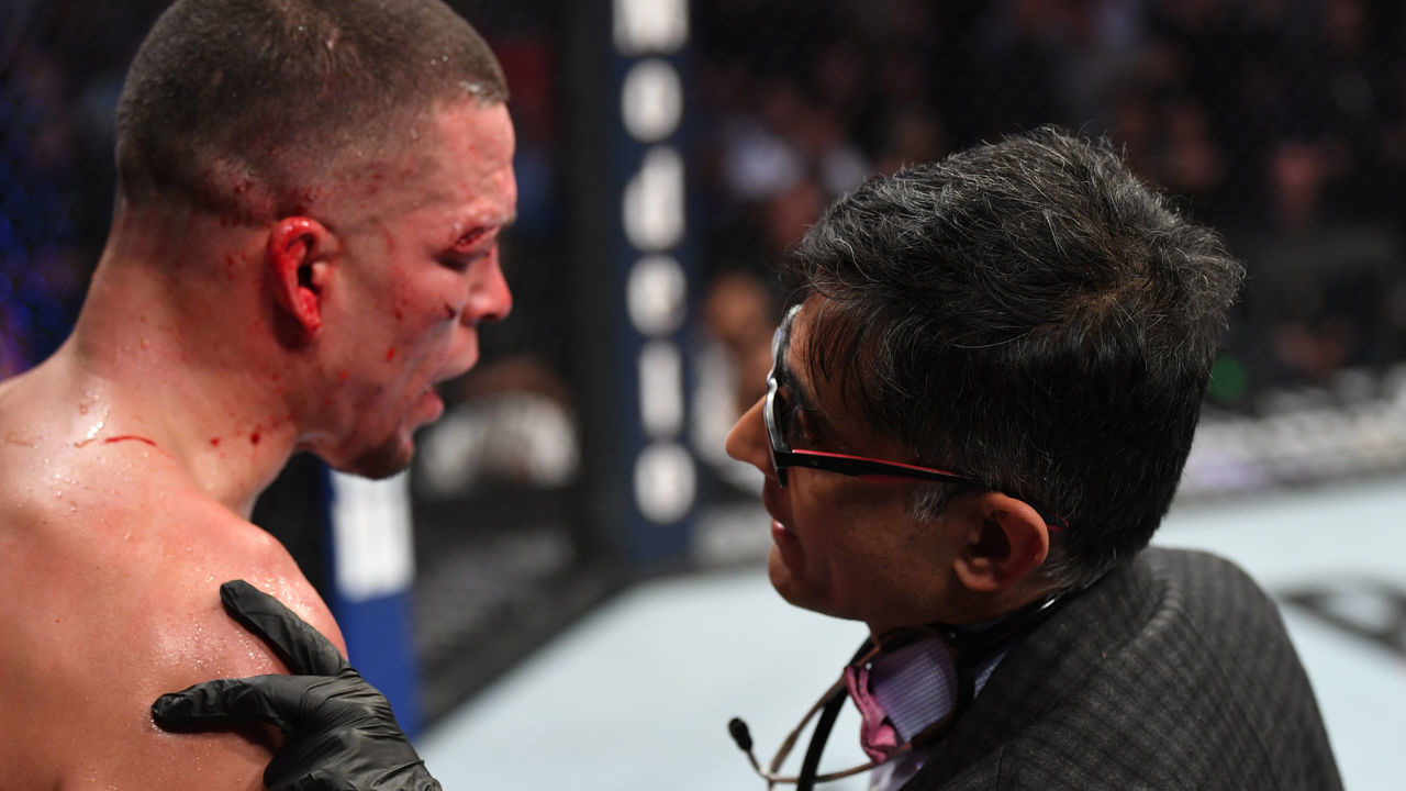 NEW YORK, NEW YORK - NOVEMBER 02: The doctor interacts with Nate Diaz between rounds of his welterweight bout against Jorge Masvidal for the BMF title during the UFC 244 event at Madison Square Garden on November 02, 2019 in New York City.
