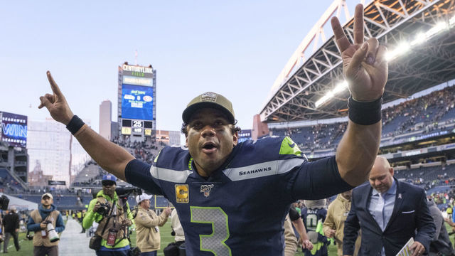 SEATTLE, WA - NOVEMBER 3: Russell Wilson #3 of the Seattle Seahawks celebrates as he leaves the field after a game against the Tampa Bay Buccaneers at CenturyLink Field on November 3, 2019 in Seattle, Washington. The Seahawks won 40-34 in overtime.