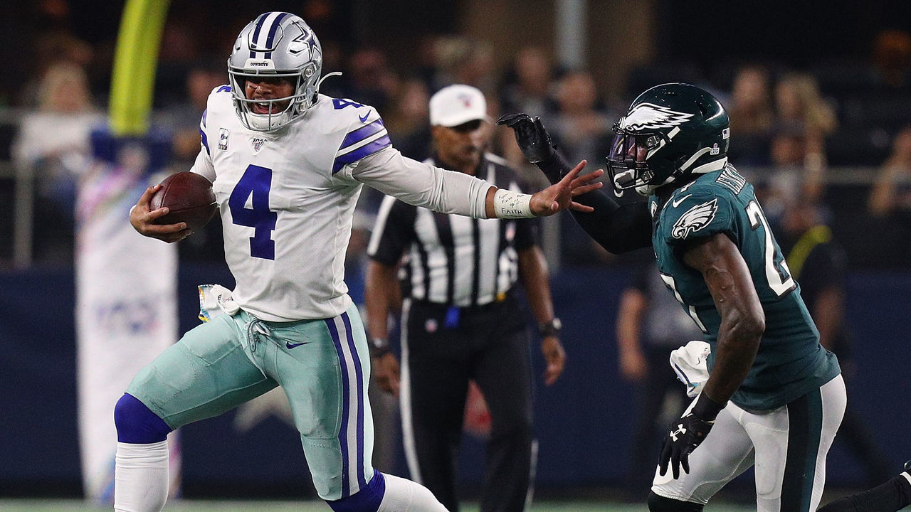 ARLINGTON, TEXAS - OCTOBER 20: Dak Prescott #4 of the Dallas Cowboys is pursued by Malcolm Jenkins #27 of the Philadelphia Eagles at AT&T Stadium on October 20, 2019 in Arlington, Texas.