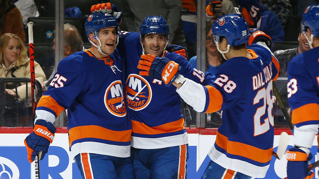 NEW YORK, NEW YORK - NOVEMBER 05: Cal Clutterbuck #15 of the New York Islanders celebrates his first period goal with Devon Toews #25 and Michael Dal Colle #28 against the Ottawa Senators at Barclays Center on November 05, 2019 in New York City.