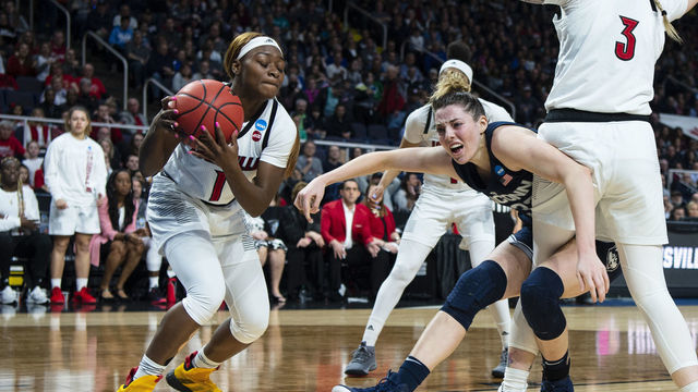 ALBANY, NY - MARCH 31: Louisville Cardinals Guard Dana Evans (1) steals the ball from Connecticut Huskies Guard / Forward Katie Lou Samuelson (33) during the first half of the game between the Connecticut Huskies and the Louisville Cardinals on March 31, 2019, at the Times Union Center in Albany NY.