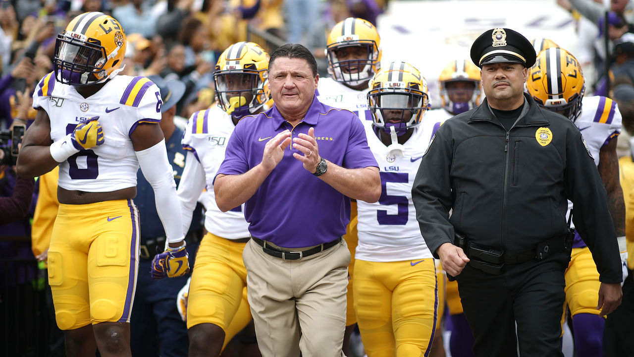 BATON ROUGE, LOUISIANA - OCTOBER 26: Head coach Ed Orgeron of the LSU Tigers leads the team on to the field against the Auburn Tigers prior to the game at Tiger Stadium on October 26, 2019 in Baton Rouge, Louisiana.