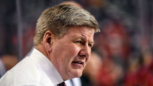 CALGARY, AB - FEBRUARY 07: Calgary Flames head coach Bill Peters watches warm ups before an NHL game where the Calgary Flames hosted the San Jose Sharks on February 7, 2019, at the Scotiabank Saddledome in Calgary, AB.
