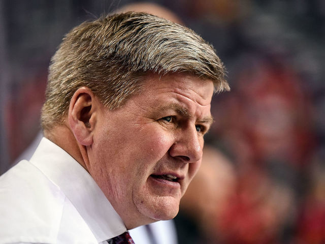 CALGARY, AB - FEBRUARY 07: Calgary Flames head coach Bill Peters watches warm ups before an NHL game where the Calgary Flames hosted the San Jose Sharks on February 7, 2019, at the Scotiabank Saddledome in Calgary, AB.