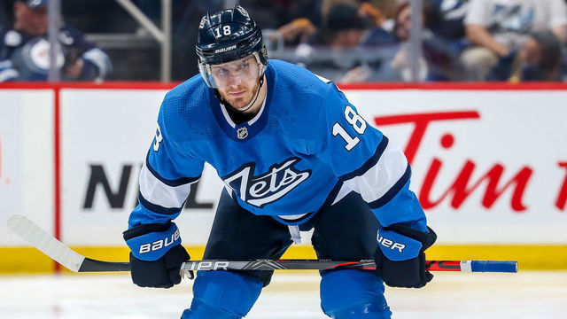 WINNIPEG, MB - NOVEMBER 5: Bryan Little #18 of the Winnipeg Jets gets set for a second period face-off against the New Jersey Devils at the Bell MTS Place on November 5, 2019 in Winnipeg, Manitoba, Canada.