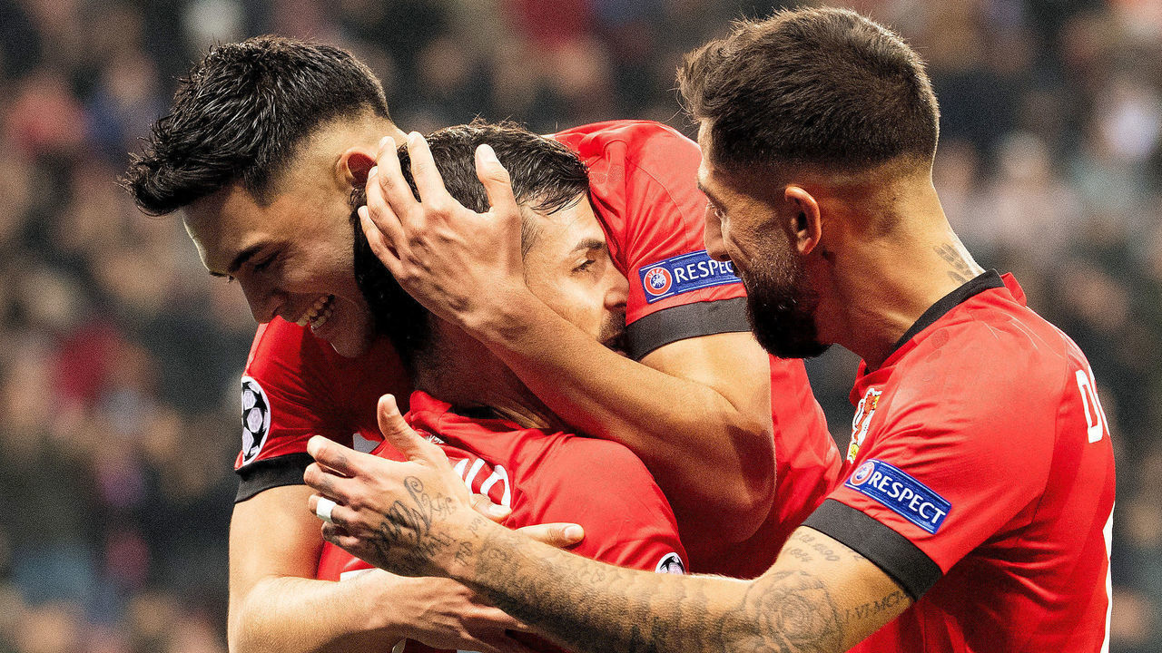 06 November 2019, North Rhine-Westphalia, Leverkusen: Soccer: Champions League, Bayer Leverkusen - Atletico Madrid, Group stage, Group D, Matchday 4. Leverkusens Kevin Volland (31) and his team mate Nadiem Amiri are happy about his goal to 2:0. Right Kerem Demirbay. Photo: Federico Gambarini/dpa