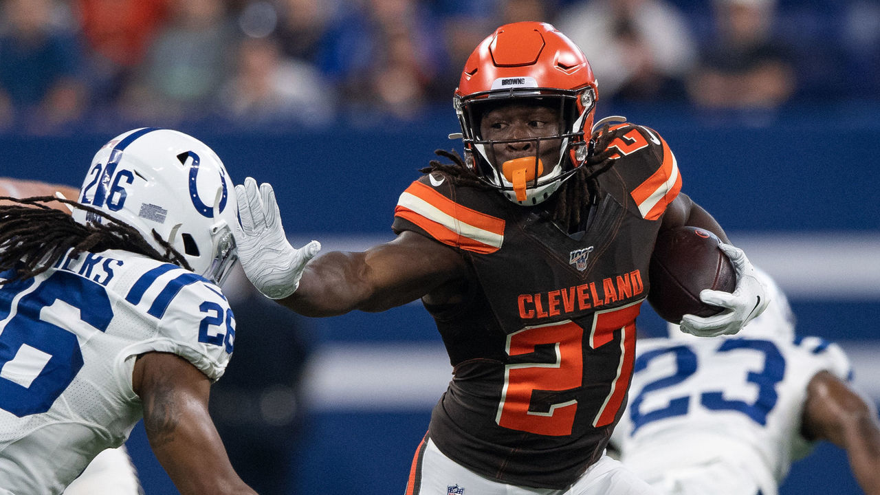 INDIANAPOLIS, IN - AUGUST 17: Cleveland Browns running back Kareem Hunt (27) gives a stiff arm to Indianapolis Colts safety Clayton Geathers (26) during the week 2 NFL preseason game between the Cleveland Browns and the Indianapolis Colts on August 17, 2019 at Lucas Oil Stadium, in Indianapolis, IN.