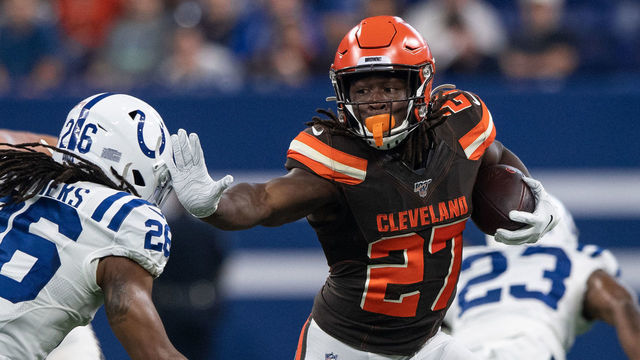 INDIANAPOLIS, IN - AUGUST 17: Cleveland Browns running back Kareem Hunt (27) gives a stiff arm to Indianapolis Colts safety Clayton Geathers (26) during the week 2 NFL preseason game between the Cleveland Browns and the Indianapolis Colts on August 17, 2019 at Lucas Oil Stadium, in Indianapolis, IN.
