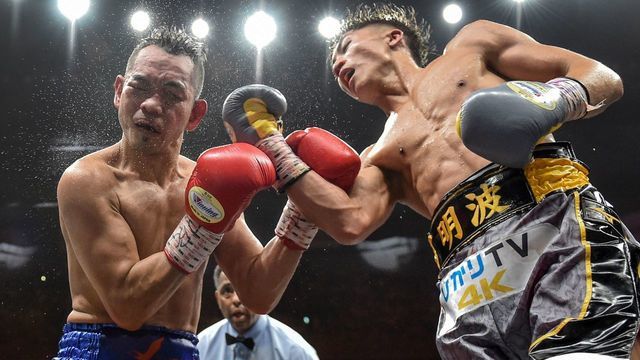 Naoya Inoue of Japan (R) and Nonito Donaire of Philippines (L) fight in their World Boxing Super Series bantamweight final at Saitama Super Arena in Saitama on November 7, 2019.