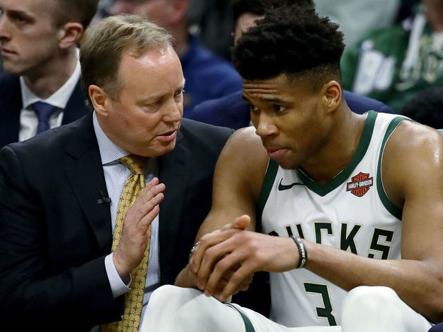 MILWAUKEE, WISCONSIN - MAY 17: Head coach Mike Budenholzer of the Milwaukee Bucks meets with Giannis Antetokounmpo #34 in the third quarter against the Toronto Raptors during Game Two of the Eastern Conference Finals of the 2019 NBA Playoffs at the Fiserv Forum on May 17, 2019 in Milwaukee, Wisconsin.