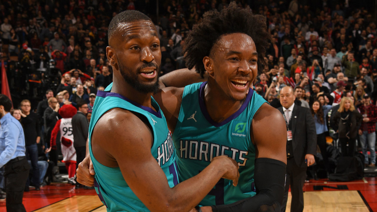 TORONTO, CANADA - MARCH 24: Kemba Walker #15 and Devonte' Graham #4 of the Charlotte Hornets celebrate with after winning the game against the Toronto Raptors on March 24, 2019 at the Scotiabank Arena in Toronto, Ontario, Canada. Mandatory Copyright Notice: Copyright 2019 NBAE