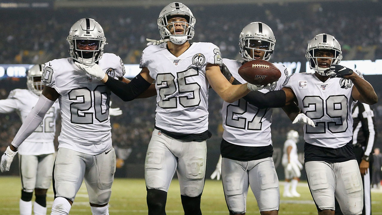 OAKLAND, CALIFORNIA - NOVEMBER 07: Erik Harris #25 of the Oakland Raiders reacts with teammates after intercepting a pass by Philip Rivers #17 of the Los Angeles Chargers in the second quarter only to have the play overturned by a penalty at RingCentral Coliseum on November 07, 2019 in Oakland, California.