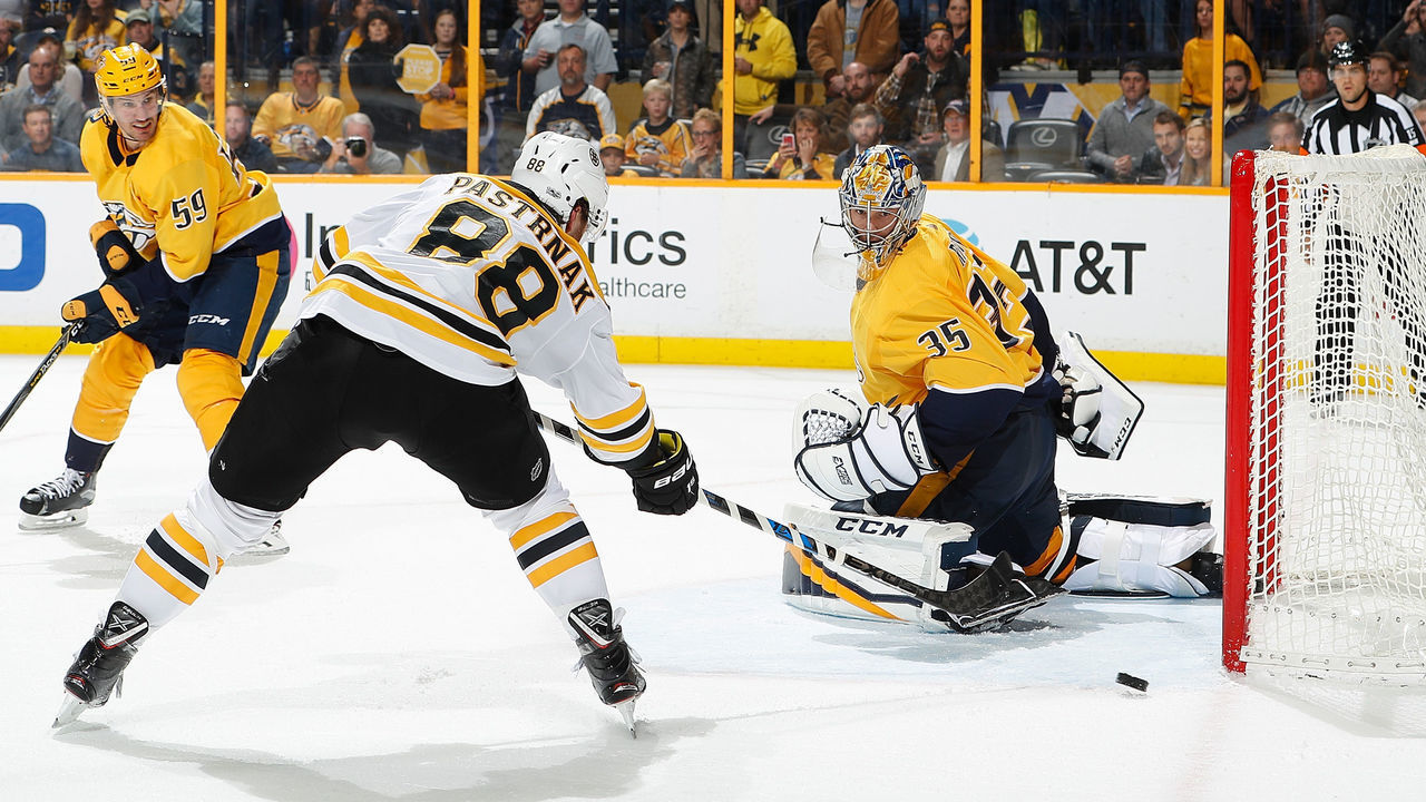 NASHVILLE, TN - DECEMBER 4: David Pastrnak #88 of the Boston Bruins shoots wide of the net against Pekka Rinne #35 of the Nashville Predators during an NHL game at Bridgestone Arena on December 4, 2017 in Nashville, Tennessee.