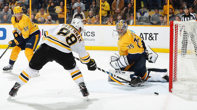 NASHVILLE, TN - DECEMBER 4: David Pastrnak #88 of the Boston Bruins shoots wide of the net against Pekka Rinne #35 of the Nashville Predators during an NHL game at Bridgestone Arena on December 4, 2017 in Nashville, Tennessee.