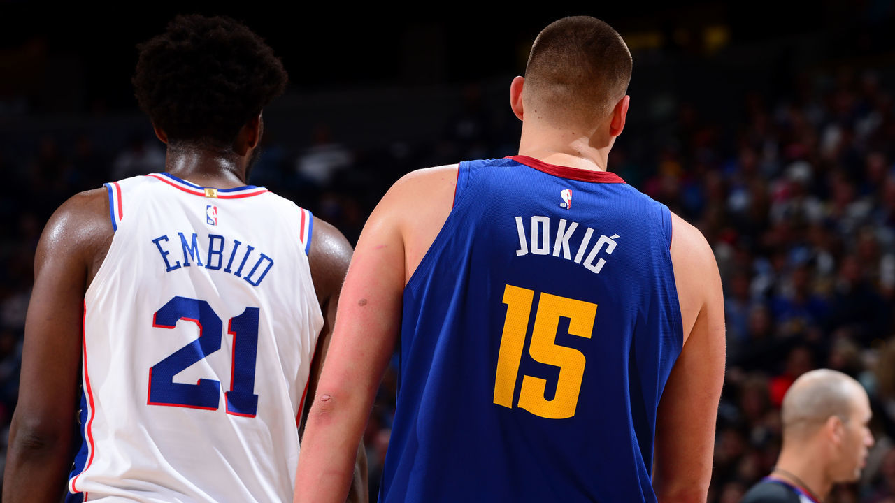 DENVER, CO - NOVEMBER 8: Joel Embiid #21 of the Philadelphia 76ers and Nikola Jokic #15 of the Denver Nuggets look on during the game on November 8, 2019 at the Pepsi Center in Denver, Colorado. NOTE TO USER: User expressly acknowledges and agrees that, by downloading and/or using this Photograph, user is consenting to the terms and conditions of the Getty Images License Agreement. Mandatory Copyright Notice: Copyright 2019 NBAE