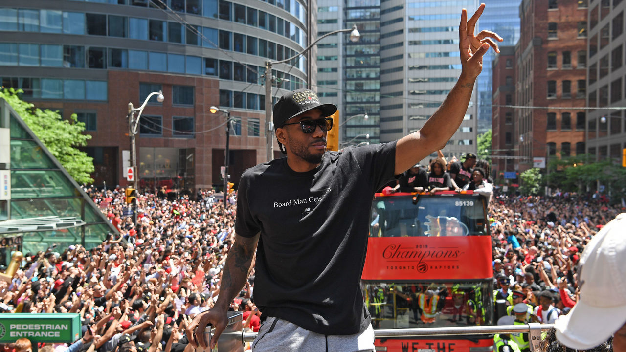 TORONTO, ON - JUNE 17: Kawhi Leonard #2 of the Toronto Raptors acknowledges the crowd during the Toronto Raptors Championship Victory Parade on June 17, 2019 in Toronto, Ontario. NOTE TO USER: User expressly acknowledges and agrees that, by downloading and/or using this photograph, user is consenting to the terms and conditions of Getty Images License Agreement. Mandatory Copyright Notice: Copyright 2019 NBAE