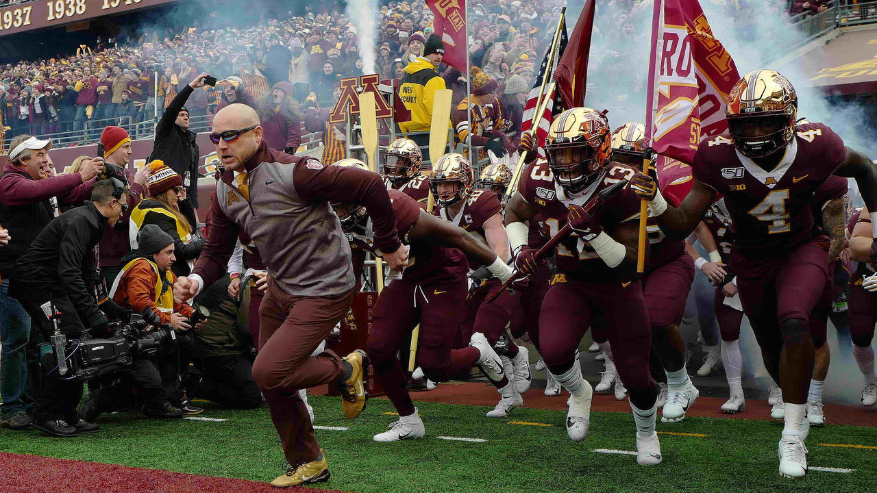 MINNEAPOLIS, MN - NOVEMBER 09: Head coach P.J. Fleck of the Minnesota Golden Gophers and his team take the field against the Penn State Nittany Lions at TCFBank Stadium on November 9, 2019 in Minneapolis, Minnesota.