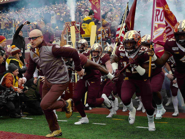 MINNEAPOLIS, MN - NOVEMBER 09: Head coach P.J. Fleck of the Minnesota Golden Gophers and his team take the field against the Penn State Nittany Lions at TCFBank Stadium on November 9, 2019 in Minneapolis, Minnesota.