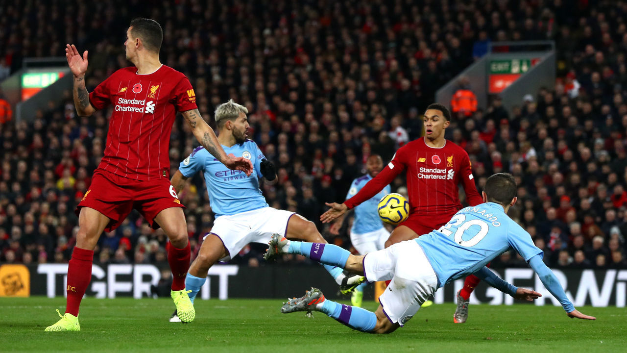 LIVERPOOL, ENGLAND - NOVEMBER 10: Bernardo Silva of Manchester City and Trent Alexander-Arnold of Liverpool handle the ball during the Premier League match between Liverpool FC and Manchester City at Anfield on November 10, 2019 in Liverpool, United Kingdom.